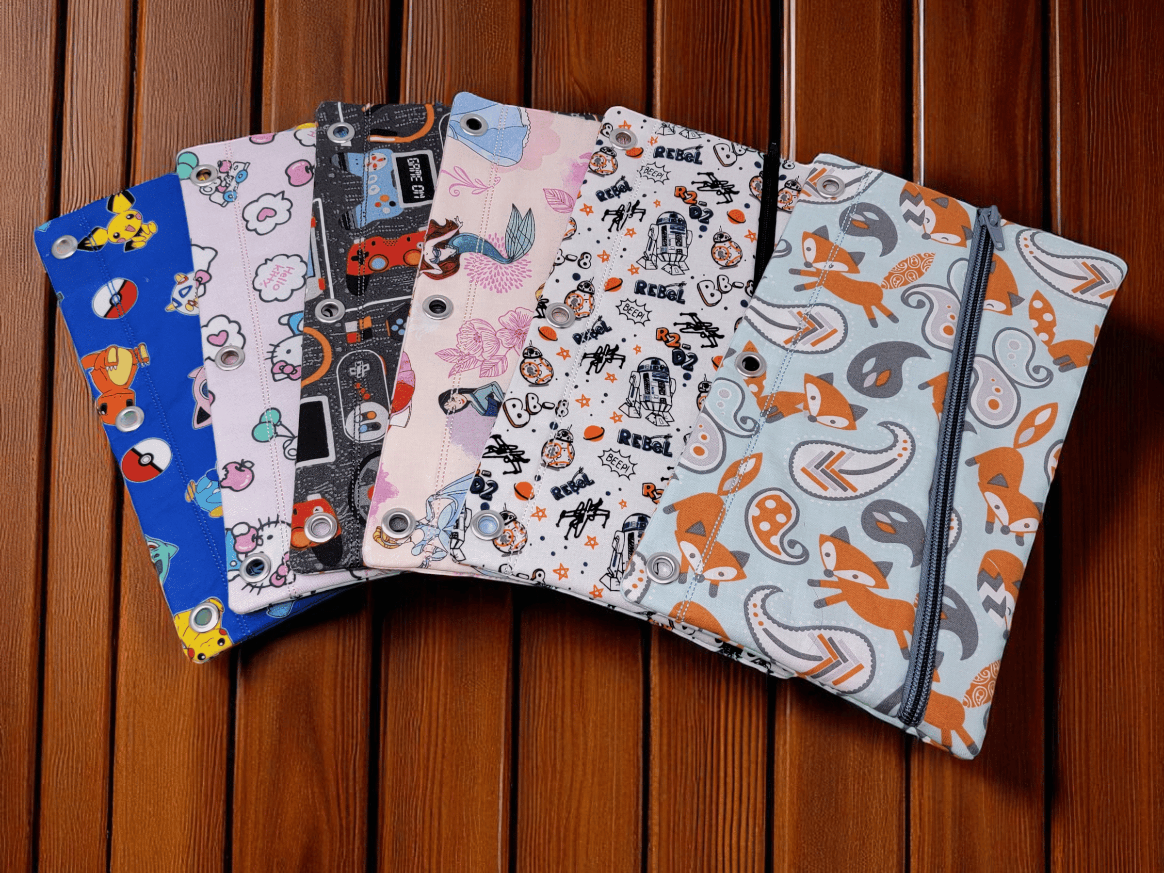 Binder pencil cases featuring a monster face or made out of kid friendly fabrics.